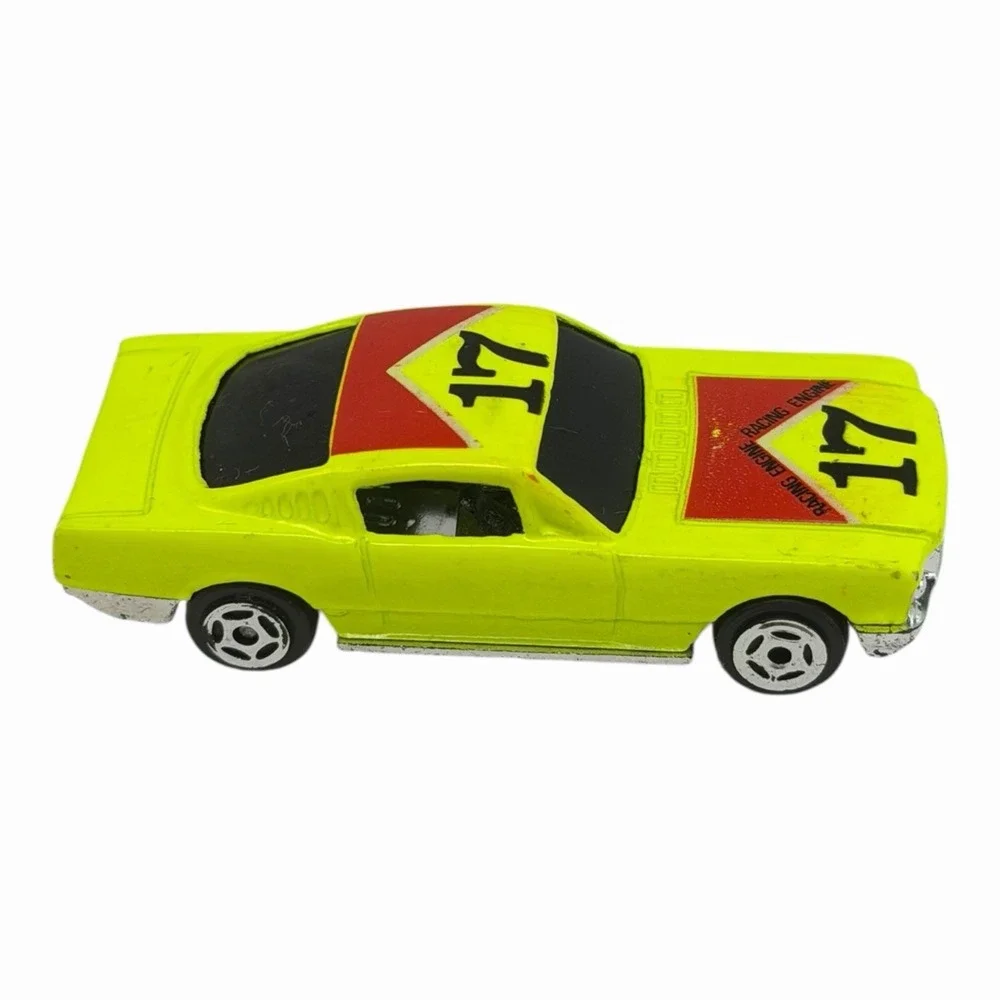 Vintage Yellow Diecast Toy Car with Racing Decals‎